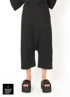 Low crotch trousers by SORT AARHUS in black, grey & spritz