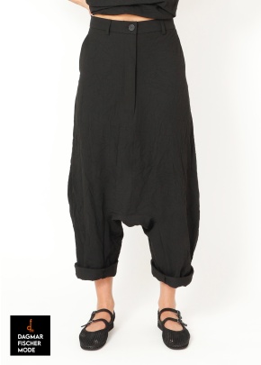 Low crotch trousers by SORT AARHUS in black, grey & spritz